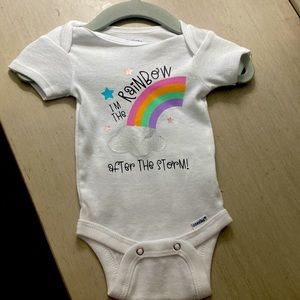 Rainbow baby announcement onesie